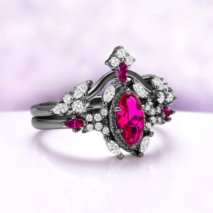 Three-quarter view of the marquise ruby in its milgrain frame with ruby shoulder accents