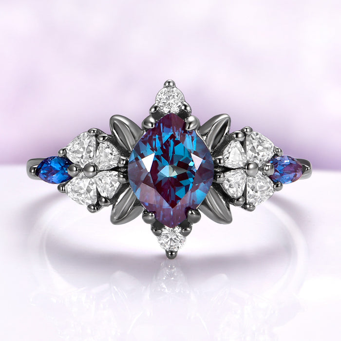 Lab-grown alexandrite engagement ring in black ruthenium showing the teal to violet color shift
