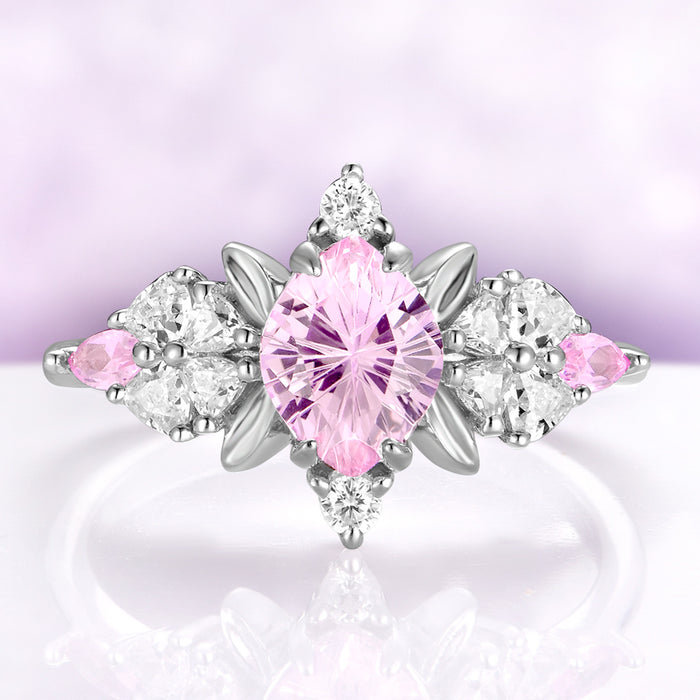 Pink sapphire engagement ring in sterling silver with fantasy cut center and leaf frame