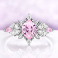 Pink sapphire engagement ring in sterling silver with fantasy cut center and leaf frame