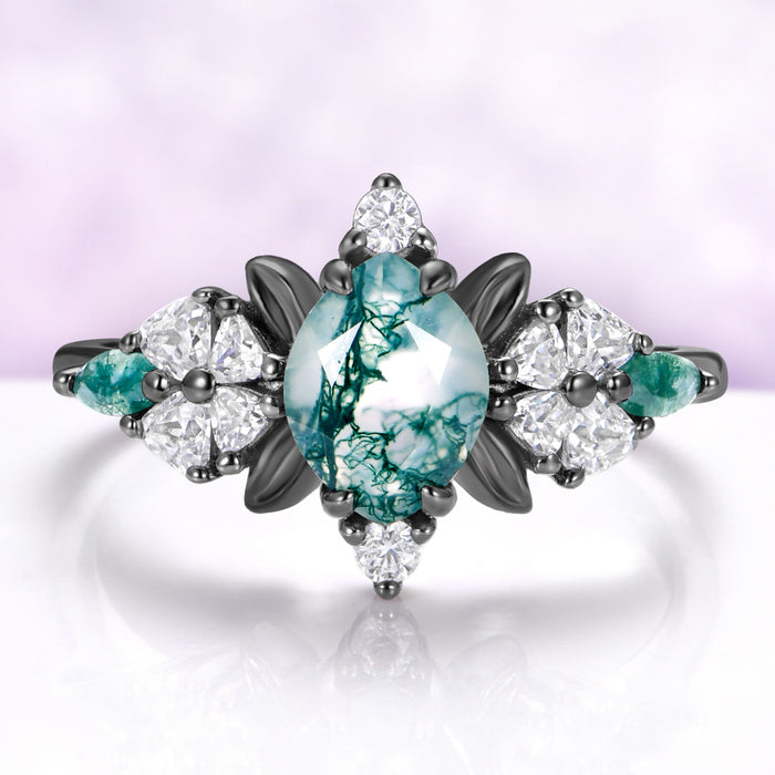 Marquise moss agate engagement ring in black ruthenium with leaf and heart cut accents