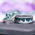 Northern Lights Pines couples ring set by Aquamarise with a hexagonal moss agate engagement ring and a green goldstone and blue sandstone tungsten band