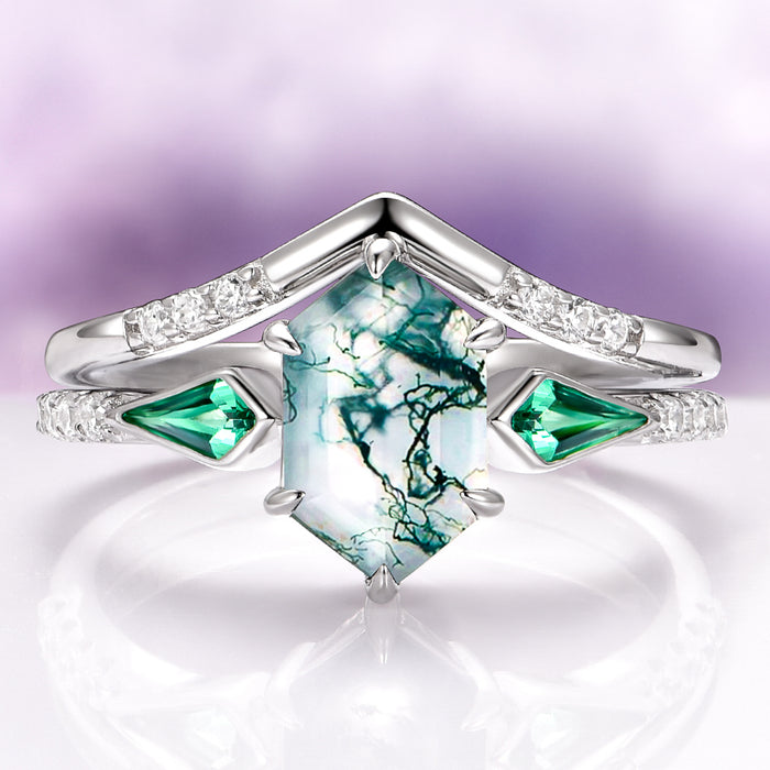Northern Lights Woodland Couples Ring Set by Aquamarise, featuring a hexagonal moss agate center with green gemstones and diamond accents on polished sterling silver bands.