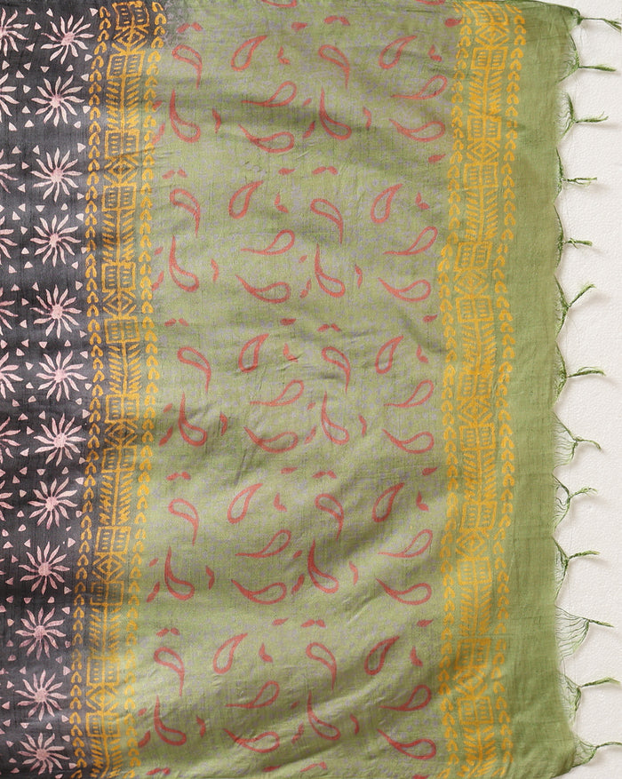 Olive green Katan silk unstitched suit set with small red and black paisley motifs, mustard yellow accents and a wide geometric printed border at the hem