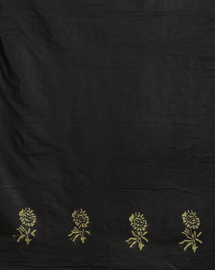 Olive green Katan silk unstitched suit set with small red and black paisley motifs, mustard yellow accents and a wide geometric printed border at the hem