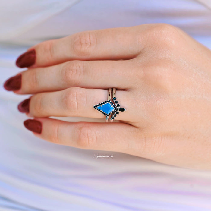 Opalescent Blue Sapphire & Black Onyx Ring Set- Sterling Silver worn on hand with burgundy nails, featuring a kite-shaped blue sapphire surrounded by black onyx by Aquamarise.