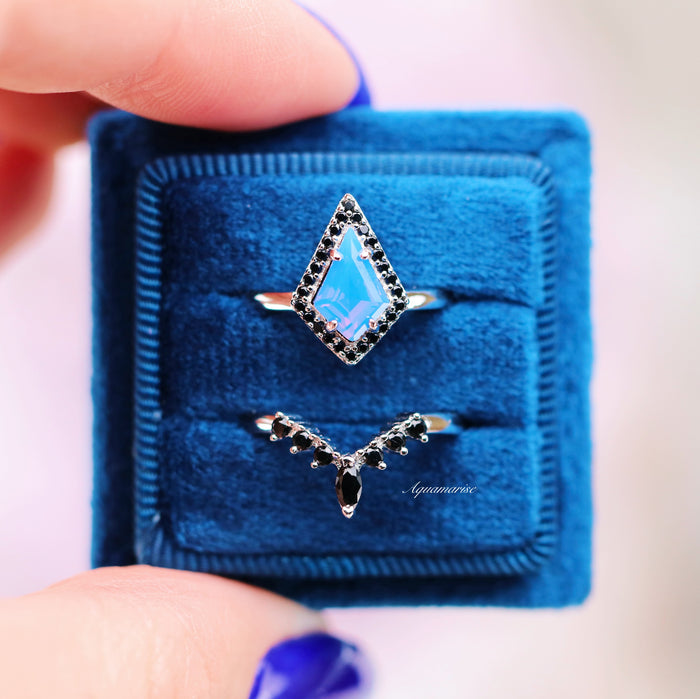 Opalescent Blue Sapphire & Black Onyx Ring Set- Sterling Silver displayed on a blue velvet pad with black stone accents, by Aquamarise from Sterling Silver Rings and Birthstone Jewelry collections.