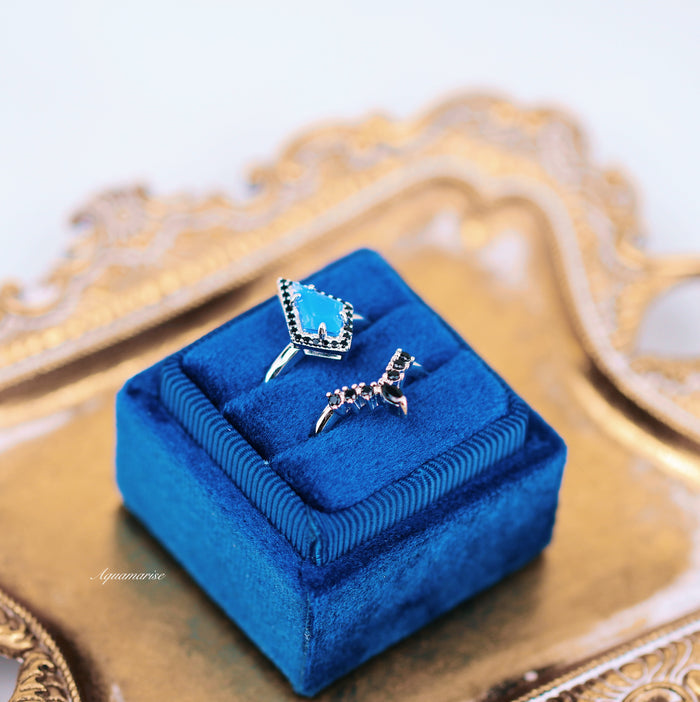 Opalescent Blue Sapphire & Black Onyx Ring Set- Sterling Silver displayed on a royal blue velvet box with intricate silver detailing, by Aquamarise from Sterling Silver Rings collection.