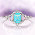 Opalescent Blue Sapphire Mermaid Engagement Ring in Sterling Silver by Aquamarise, featuring a rectangular light blue sapphire center flanked by triangular opalescent accents and sparkling diamonds on a delicate sterling silver band, part of Sterling Silver Rings, September Birthstone Jewelry, Engagement Rings for Women, and Nature-Inspired Engagement Rings collections.