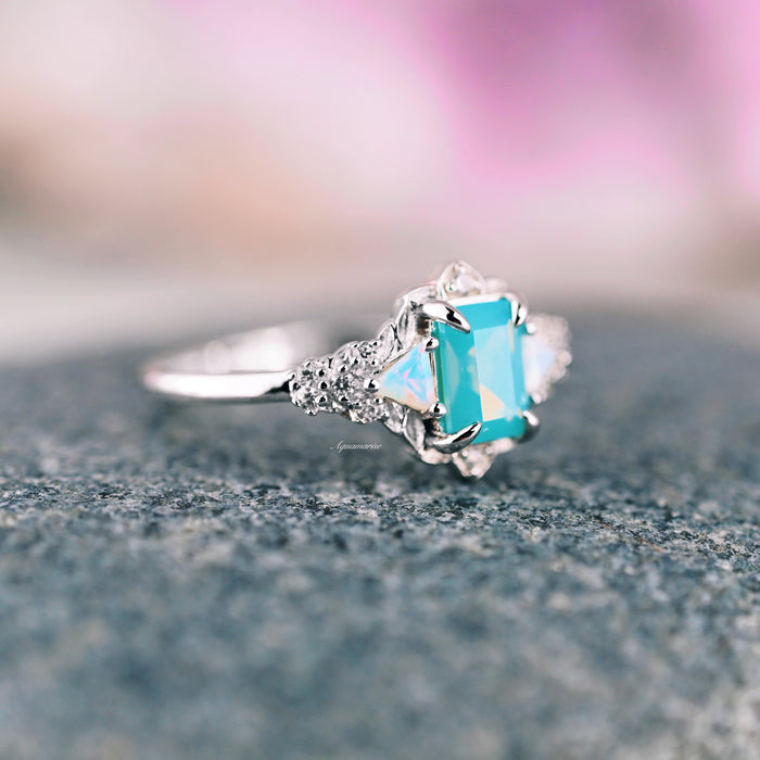 Opalescent Blue Sapphire Mermaid Engagement Ring in Sterling Silver by Aquamarise, featuring a radiant light blue sapphire set in a claw-shaped sterling silver band with sparkling diamond accents, part of Sterling Silver Rings, September Birthstone Jewelry, and Nature-Inspired Engagement Rings collections.