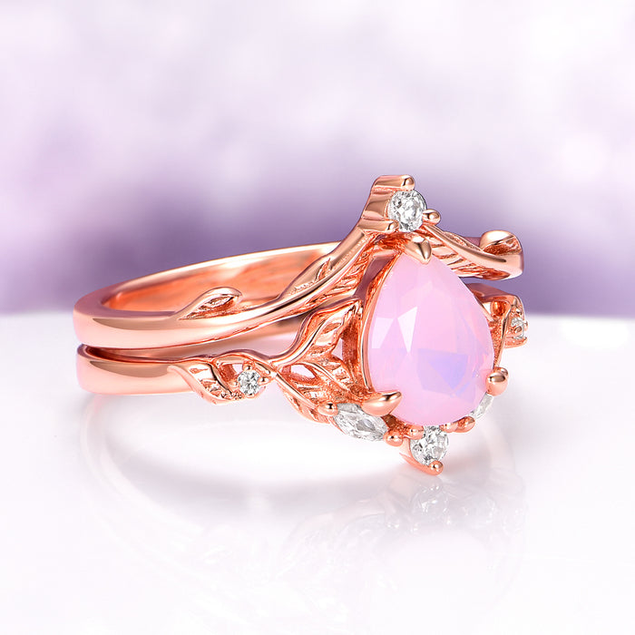 Opalescent Pink Sapphire Engagement Ring Set in 14K Rose Gold Vermeil by Aquamarise featuring a pear-shaped pink sapphire with vine-inspired band and diamond accents.