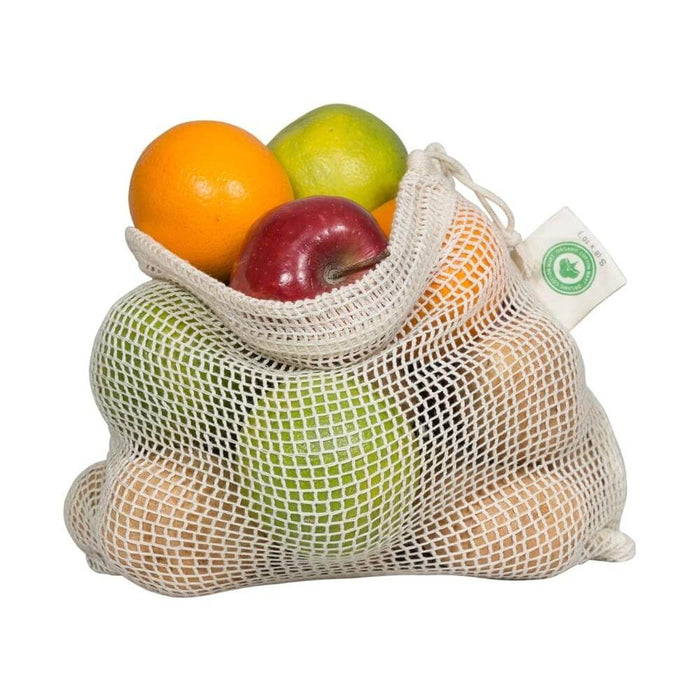 Organic cotton reusable produce bags filled with fresh fruits, promoting eco-friendly grocery shopping.