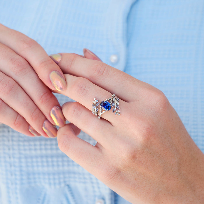Orion Nebula™ & Cornflower Sapphire Leaf Couples Ring Set by Aquamarise showcasing a silver band with a vibrant cornflower sapphire center stone surrounded by delicate leaf and diamond accents, part of Matching Couples' Rings, September Birthstone Jewelry, and Leaf Rings collections.