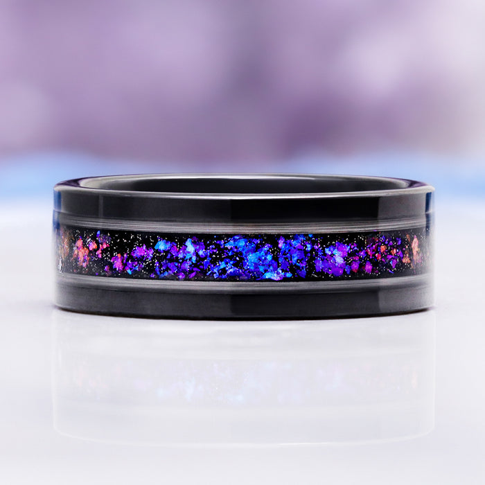 Side profile of the nebula opal inlay glowing against the brushed black tungsten band