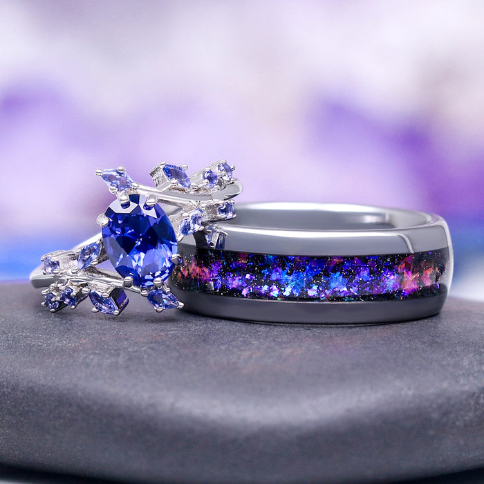 Galaxy Orion Nebula™ & Sapphire Couples Ring Set by Aquamarise featuring a silver leaf design with cornflower sapphire and a cosmic-inspired band, perfect for matching couples rings.