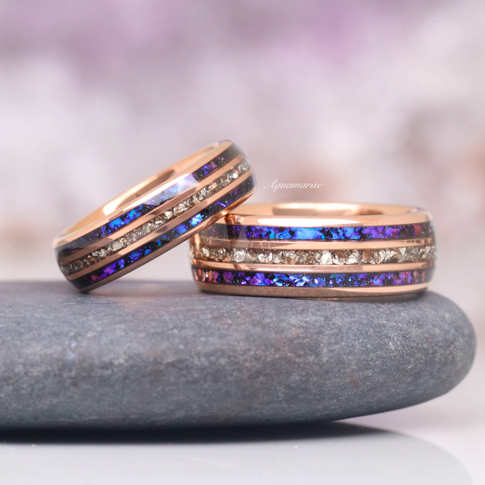 Orion Nebula™ & Crushed Diamond Couples Ring Set by Aquamarise featuring celestial blue and crushed diamond inlays in matching bands on a smooth stone background.