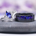 Natural Tanzanite Chevron Ring Set in 14K White Gold (two-piece) featuring a marquise-cut violet-blue tanzanite centerpiece with diamond accents alongside a black band inlaid with shimmering blue flakes, crafted by Aquamarise Gold.