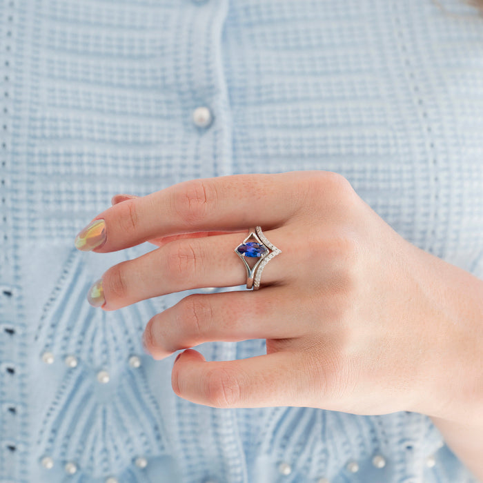 Natural Tanzanite Chevron Ring Set in 14K White Gold (two-piece) by Aquamarise Gold, featuring a marquise violet-blue tanzanite centerpiece framed by a chevron band with sparkling diamond accents, elegant and unique.