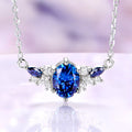 Oval midnight blue moissanite cluster necklace in sterling silver with blue marquise and clear moissanite accents