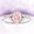 Oval Cut Blush Pink Morganite Ring in Sterling Silver by Aquamarise featuring a vintage-inspired oval peachy-pink morganite with delicate leaf and diamond accents in a sterling silver band.