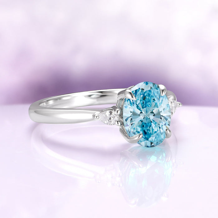 Oval Cut Natural Swiss Topaz Engagement Ring in Sterling Silver by Aquamarise, featuring a bright oval Swiss blue topaz center with sparkling side accents, part of Sterling Silver Rings, November Birthstone, and Engagement Rings for Women collections.