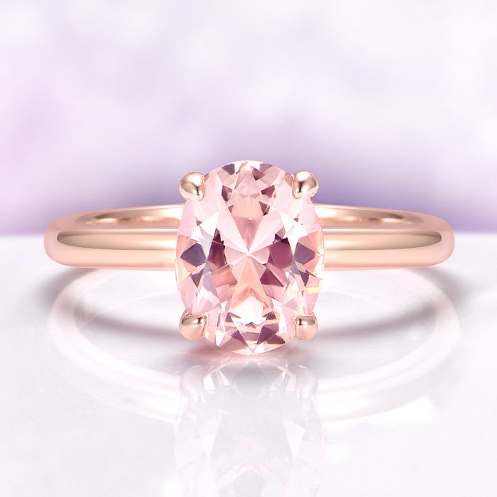 Oval Solitaire Morganite Engagement Ring in 14K Rose Gold Vermeil by Aquamarise, featuring a 2-carat peachy-pink simulated morganite set in a minimalist polished rose gold band.