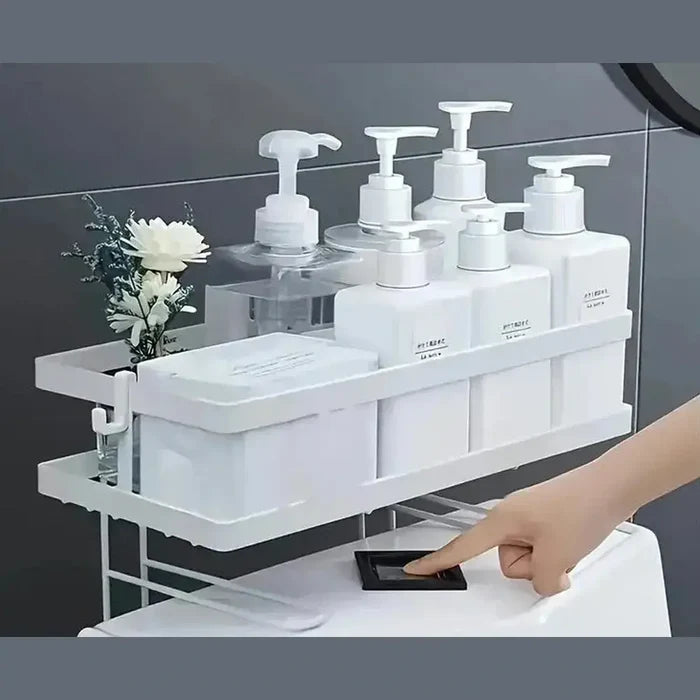 Over the toilet storage shelf displaying bathroom essentials and decorative flower, enhancing bathroom organization.