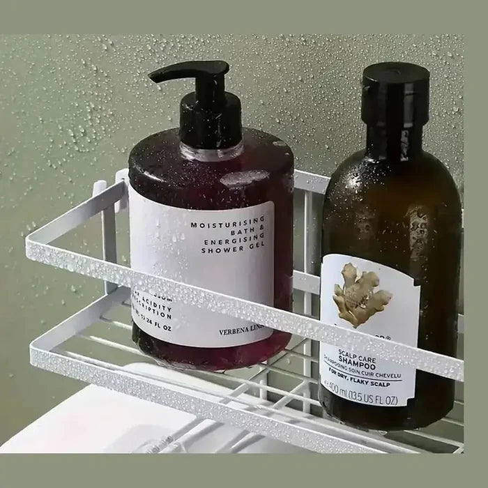 Over the toilet storage shelf holding moisturizing shower gel and scalp care shampoo in a bathroom setting.