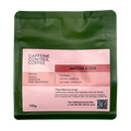 Caffeine Control Coffee package with pink label on a white background