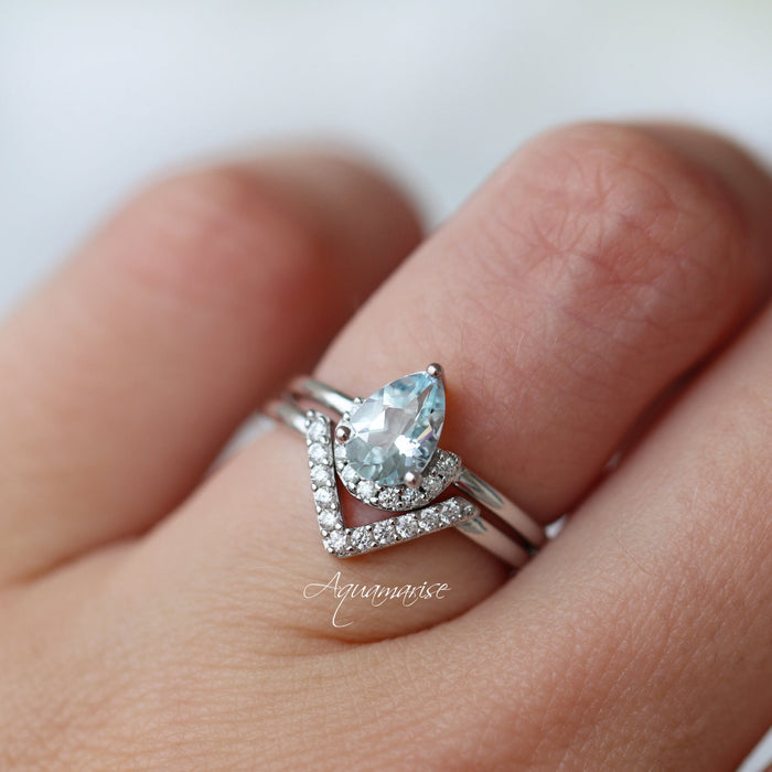 Pear Aquamarine Chevron Stacking Ring Set in Sterling Silver showcasing a pear-cut aquamarine with diamond accents in a stylish chevron design by Aquamarise.