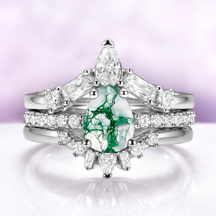Pear Green Moss Agate Three-Piece Bridal Ring Set in Sterling Silver by Aquamarise featuring a pear-shaped green moss agate with sparkling white diamond accents on a polished band.