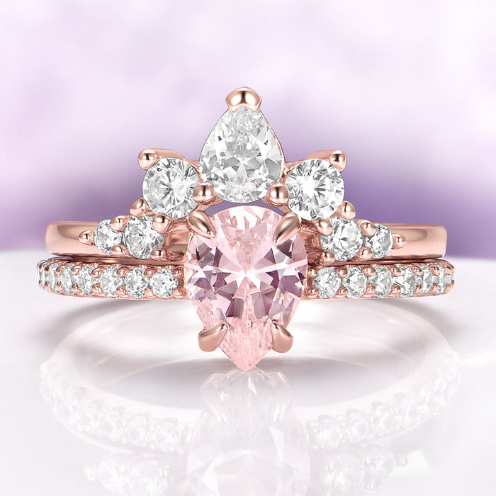 Pear Morganite Engagement Ring Set in 14K Rose Gold Vermeil by Aquamarise, featuring a pear-shaped morganite and sparkling white stones in a fantasy-inspired rose gold design.