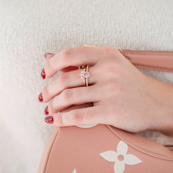 Teardrop Morganite Ring Set- 14K Rose Gold Vermeil by Aquamarise featuring a pear-shaped morganite with pavé stones on a rose gold vermeil band, styled on a hand with red nails holding a pink handbag.