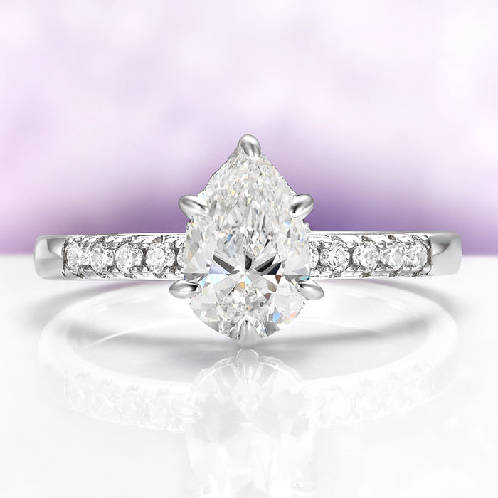 Pear White Sapphire Art Deco Bridal Ring Set in Sterling Silver by Aquamarise, featuring a pear-shaped white sapphire with pavé accents on a sleek sterling silver band.