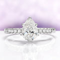 Pear White Sapphire Art Deco Bridal Ring Set in Sterling Silver by Aquamarise, featuring a pear-shaped white sapphire with pavé accents on a sleek sterling silver band.