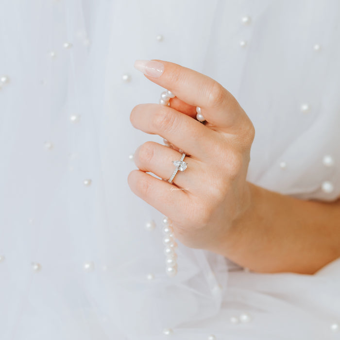 Pear Moissanite Engagement Ring in 14K White Gold (Hidden Halo)