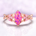Pink Fire Opal & Sapphire Celtic Knot Ring in 14K Rose Gold Vermeil by Aquamarise, featuring a marquise pink fire opal center with sapphire accents and intricate rose gold knot design.