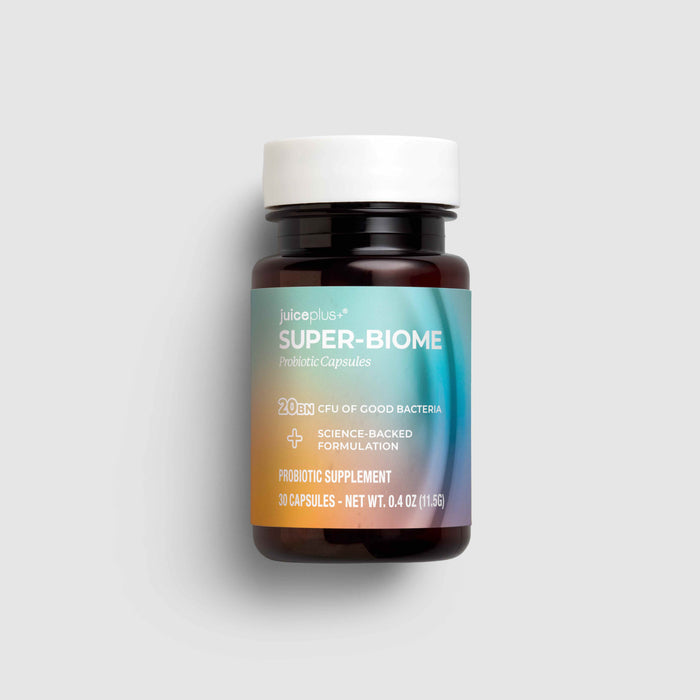 A bottle of JuloPlus Super-Biome Probiotic Supplements on a light gray background. The bottle is dark amber brown with a white cap and a label featuring a blue-to-orange gradient.