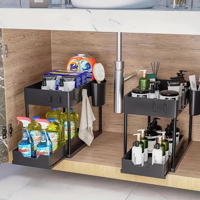Under-sink organization system with various cleaning supplies and toiletries.