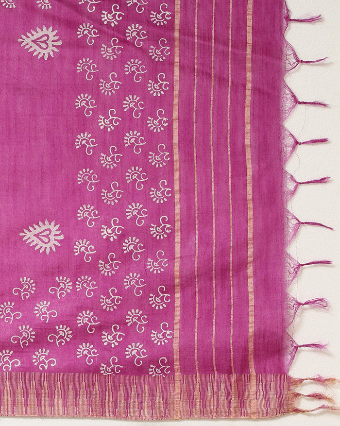 Fuchsia purple katan silk unstitched suit set with all-over white and pale gold floral hand block print, and a dupatta with striped ends and decorative fringe.