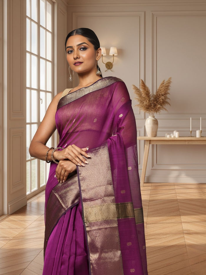 Handloom Maheshwari silk saree in purple, flower buti scattered across the body, with a wide golden zari border
