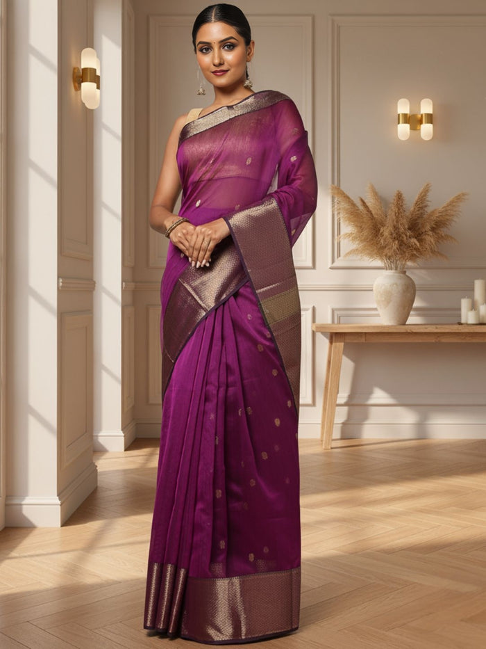 Handloom Maheshwari silk saree in purple, flower buti scattered across the body, with a wide golden zari border