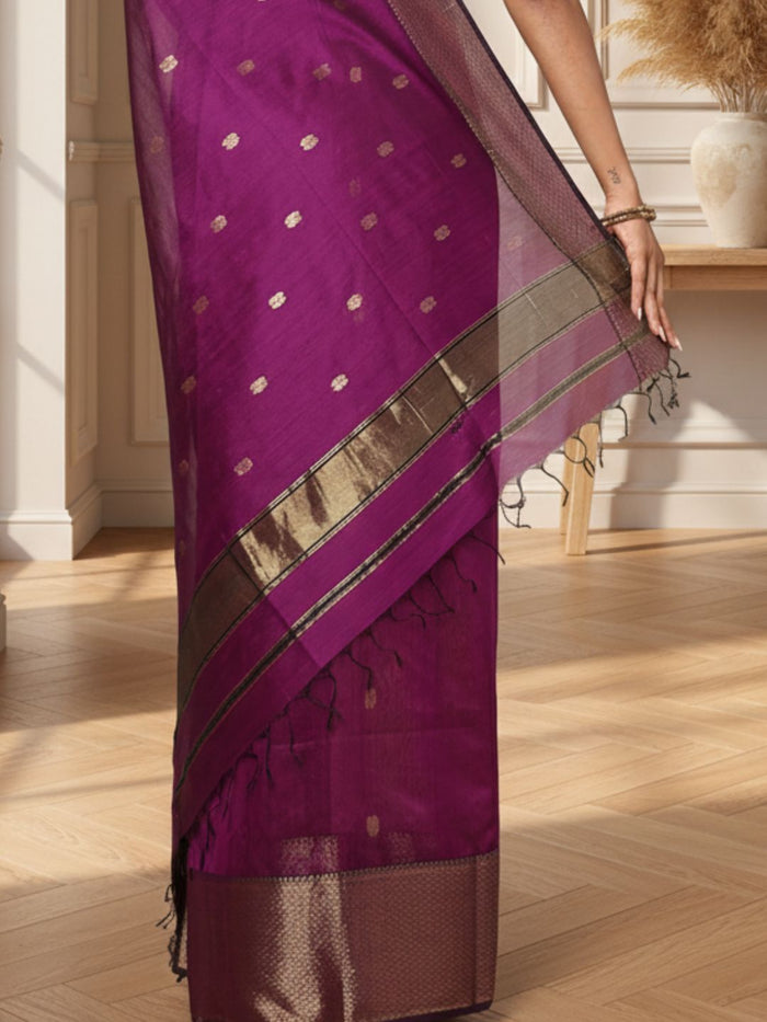 Handloom Maheshwari silk saree in purple, flower buti scattered across the body, with a wide golden zari border
