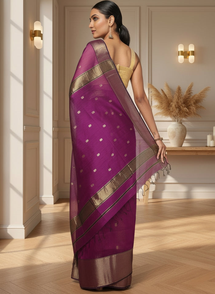 Handloom Maheshwari silk saree in purple, flower buti scattered across the body, with a wide golden zari border