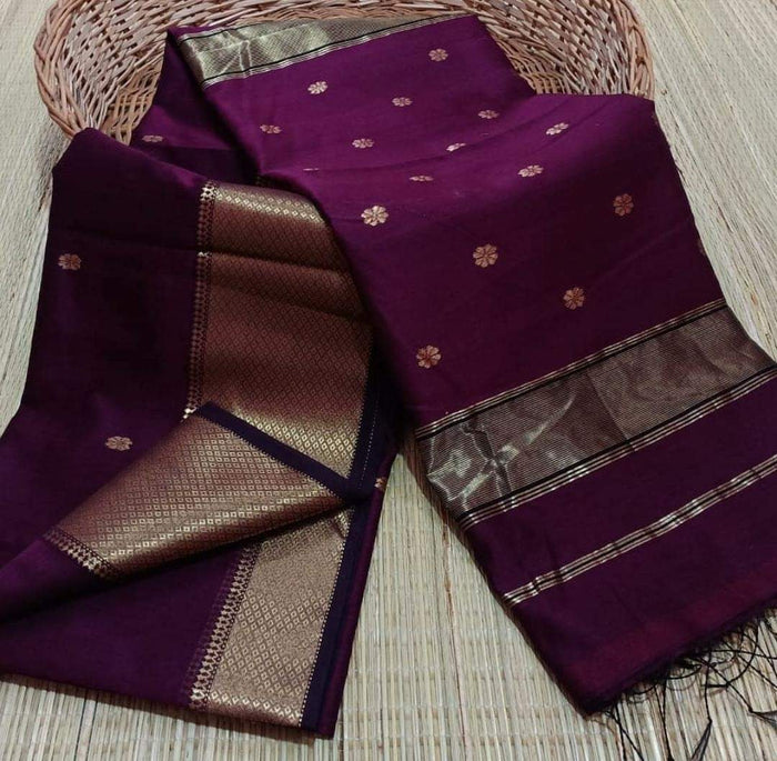 Handloom Maheshwari silk saree in purple, flower buti scattered across the body, with a wide golden zari border