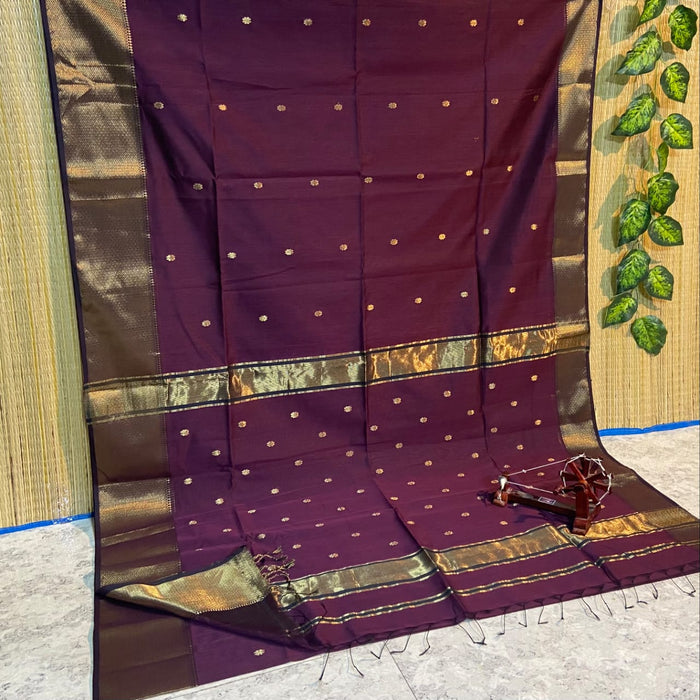 Handloom Maheshwari silk saree in purple, flower buti scattered across the body, with a wide golden zari border