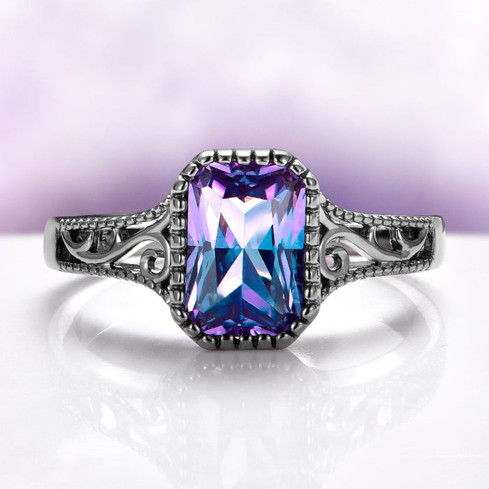 Ring with a large purple gemstone on a white background