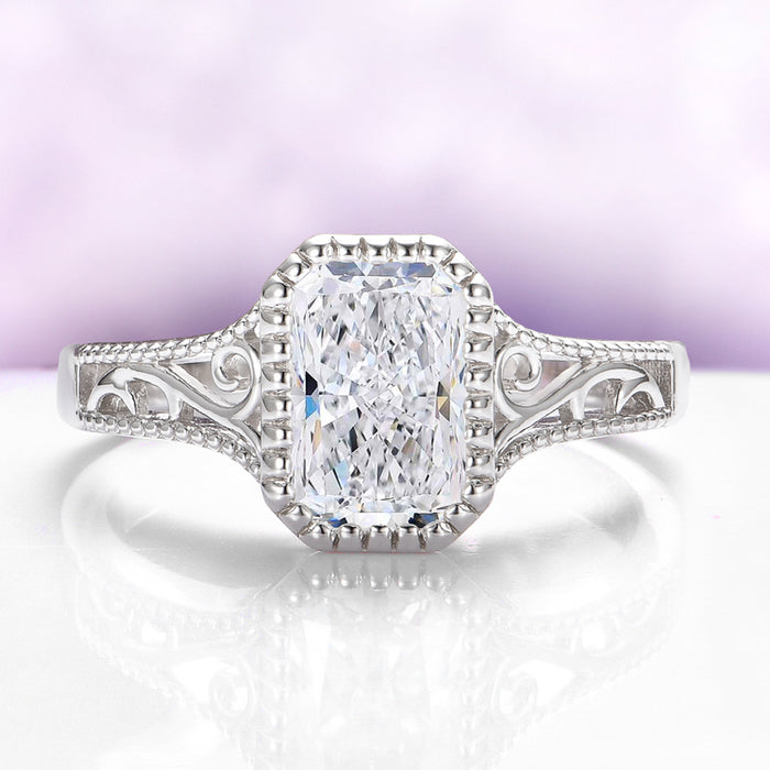 Lab Grown Diamond Engagement Ring in 14K White Gold (IGI Certified) by Aquamarise Gold, featuring an ornate white gold band with intricate scrollwork around a radiant-cut diamond.