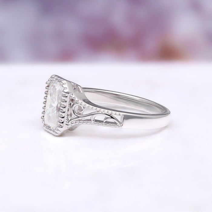 Lab Grown Diamond Engagement Ring in 14K White Gold (IGI Certified) by Aquamarise Gold, featuring intricate filigree details and a radiant cut diamond centerpiece.