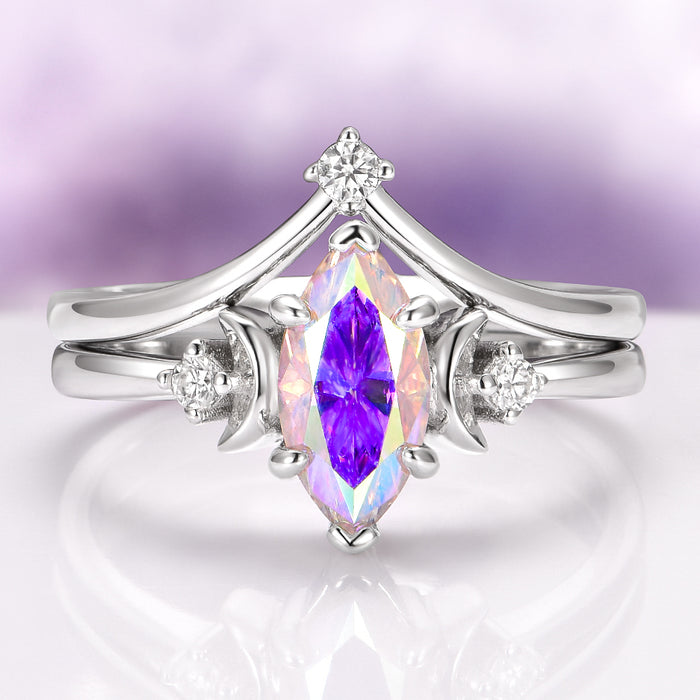 Rainbow Moissanite Crescent Moon Engagement Ring Set in Sterling Silver by Aquamarise Gold, featuring a marquise-cut rainbow moissanite center stone with pastel violet, blue, and gold flashes, set in polished sterling silver, part of Sterling Silver Rings and Moissanite Engagement Rings collections.